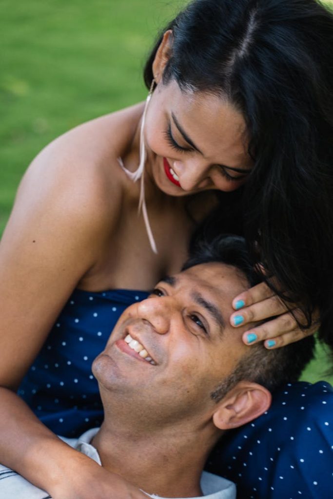 Happy couple sharing a tender moment outdoors, showcasing love and togetherness.